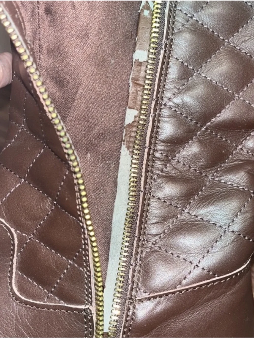 Iman Brown Quilted Knee-High Riding Boots with gold logo medallion